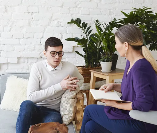 A man and woman are sitting in chairs